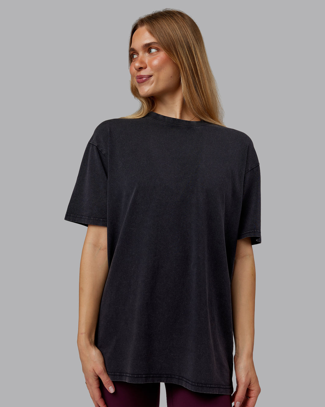 Woman wearing Rise &amp; Lift Washed FLXCotton Oversized Tee - Black-Plum Berry | Model:Emilie | Size:XS