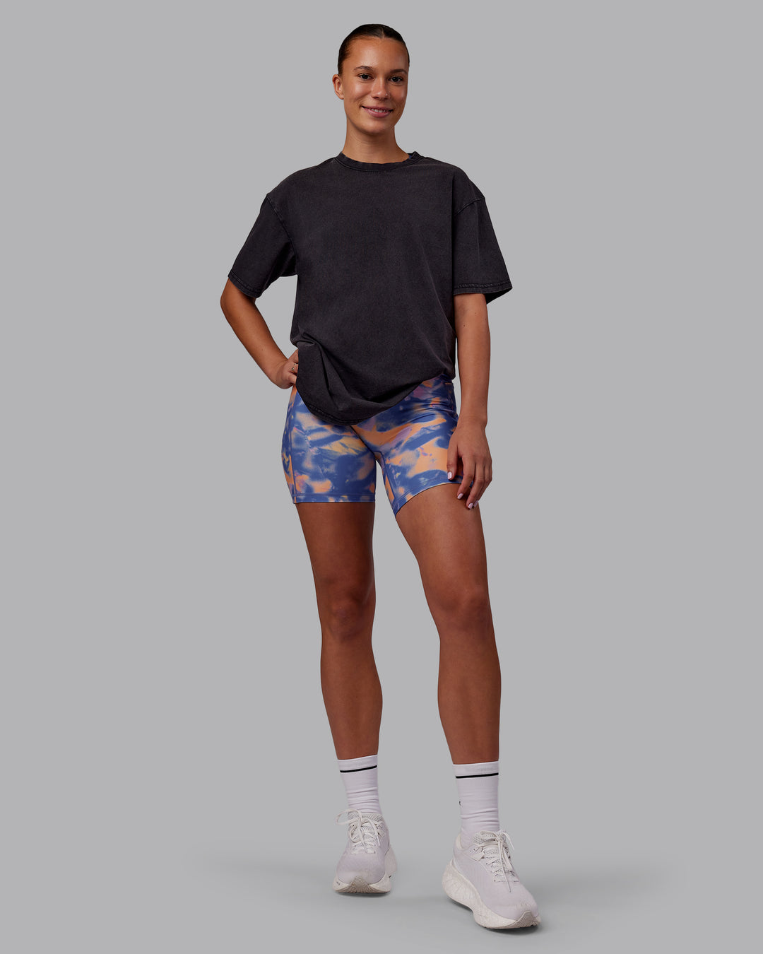 Man wearing Rise &amp; Lift Washed FLXCotton Oversized Tee - Black-Warm Apricot | Model:Charlize | Size:XS