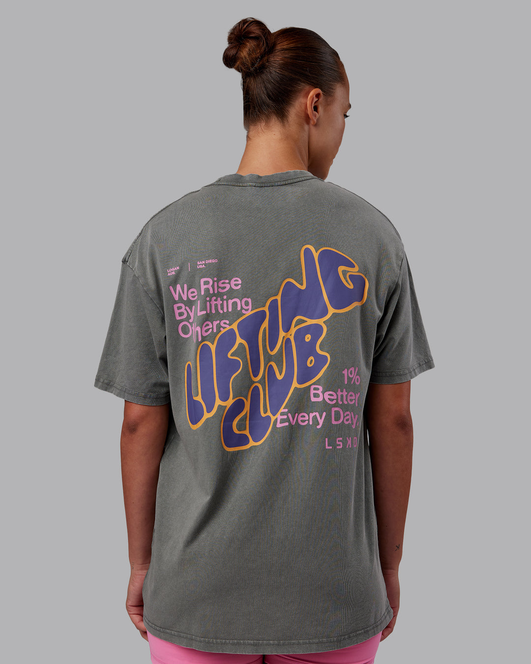 Woman wearing Rise &amp; Lift Washed FLXCotton Oversized Tee - Graphite-Purple Opulence | Model:Charlize | Size:XS