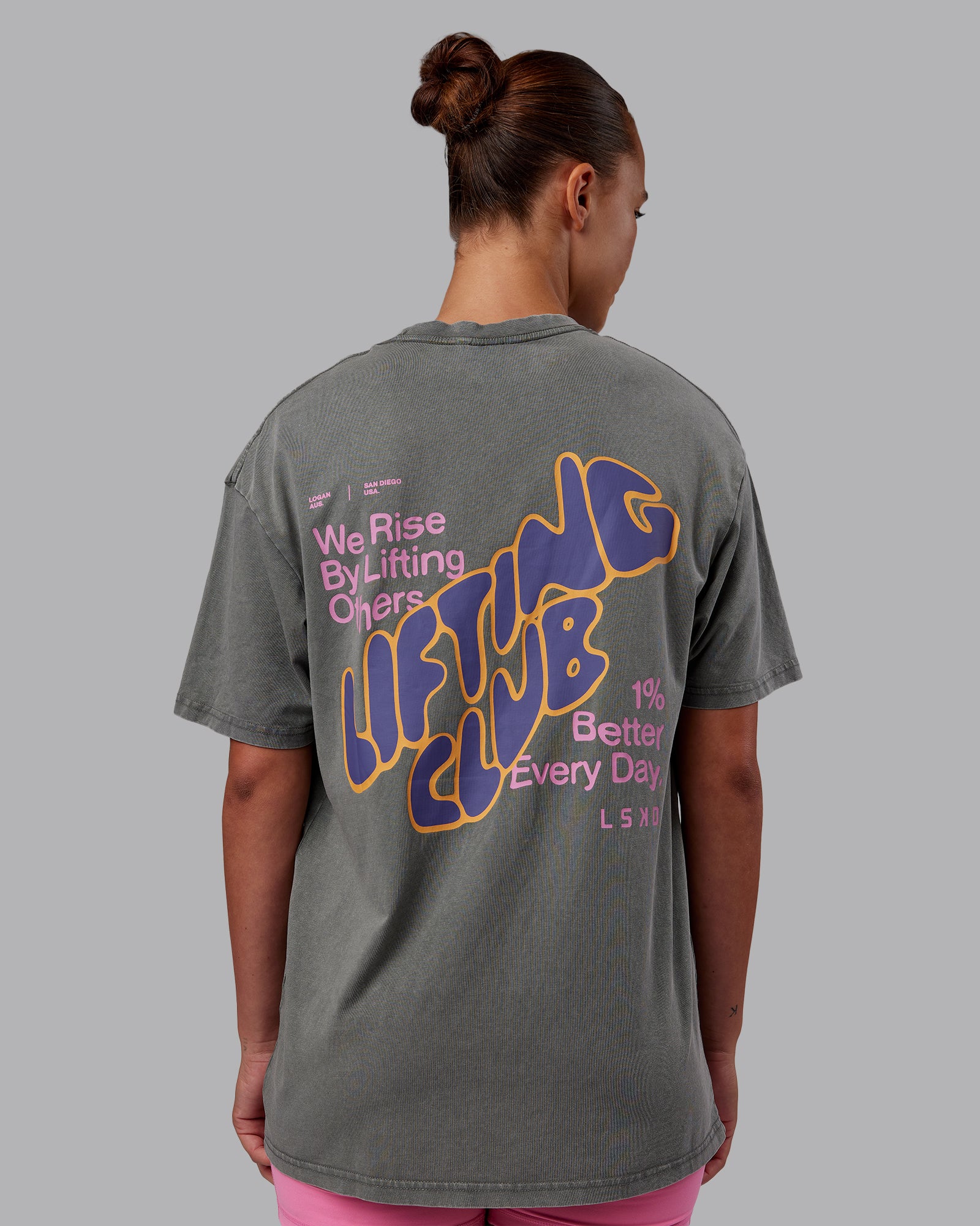 Woman wearing Rise & Lift Washed FLXCotton Oversized Tee - Graphite-Purple Opulence | Model:Charlize | Size:XS