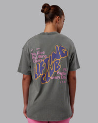 Woman wearing Rise & Lift Washed FLXCotton Oversized Tee - Graphite-Purple Opulence | Model:Charlize | Size:XS