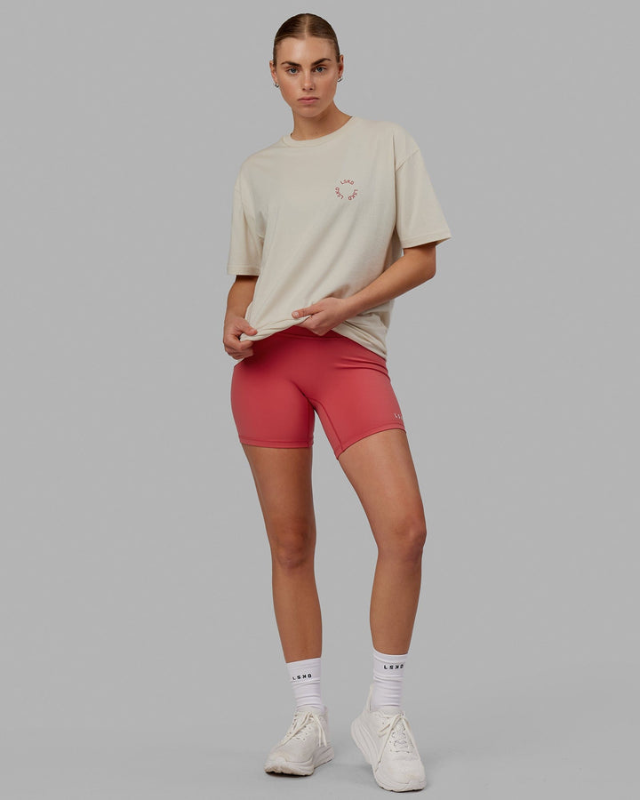 Woman wearing Unisex Rotate Tee Oversize - Bone-Mineral Red