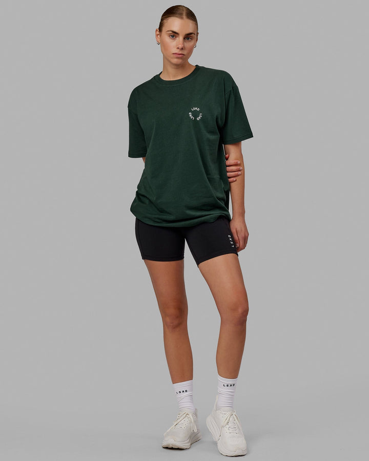 Woman wearing Unisex Rotate Tee Oversize - Vital Green-White