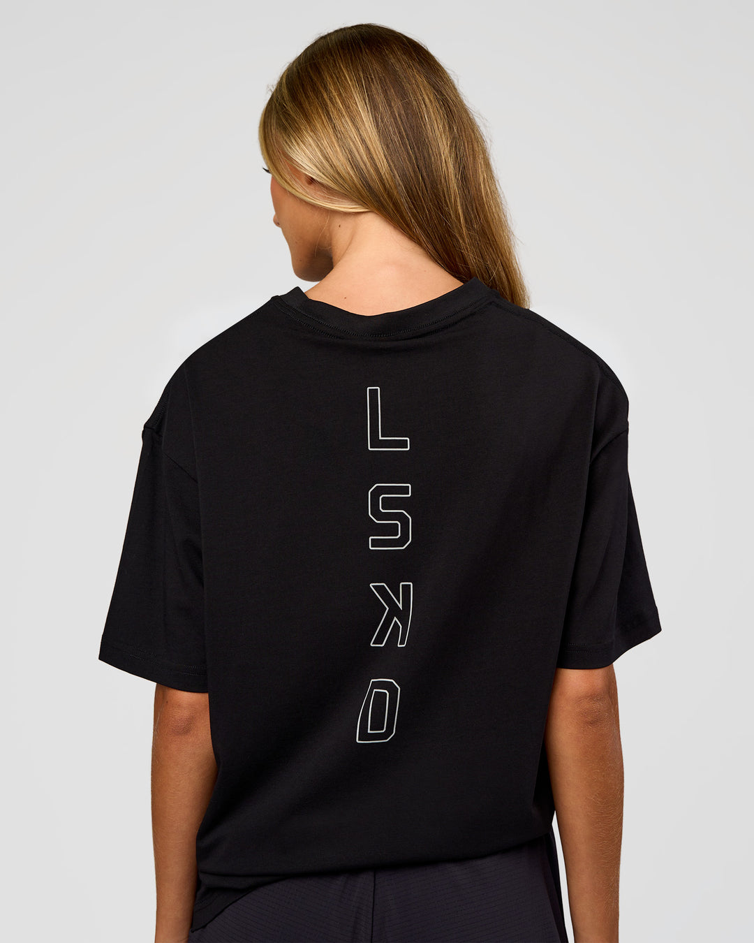 Woman wearing Run Club Script FLXCotton Oversized Tee - Black-Alloy | Model:Georgia | Size:XS