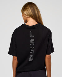 Woman wearing Run Club Script FLXCotton Oversized Tee - Black-Alloy | Model:Georgia | Size:XS