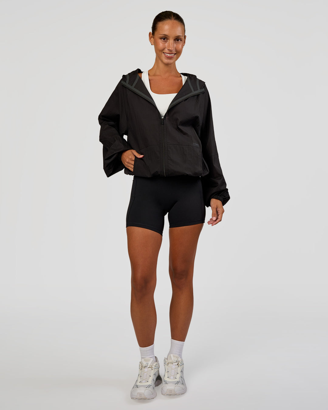 Woman wearing Run Light Jacket - Black | Model:Brylee | Size:XS