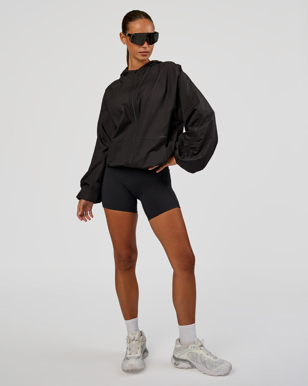 Woman wearing Run Light Jacket - Black | Model:Brylee | Size:XS