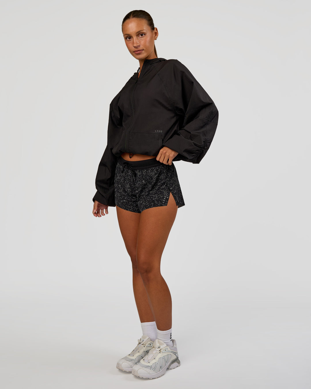 Woman wearing Run Light Jacket - Black | Model:Brylee | Size:XS