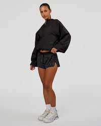 Woman wearing Run Light Jacket - Black | Model:Brylee | Size:XS