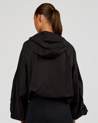 Woman wearing Run Light Jacket - Black | Model:Brylee | Size:XS