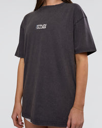 Woman wearing Runner's FLXCotton Oversized Tee - Black Washed-White | Model:Estella | Size:XS
