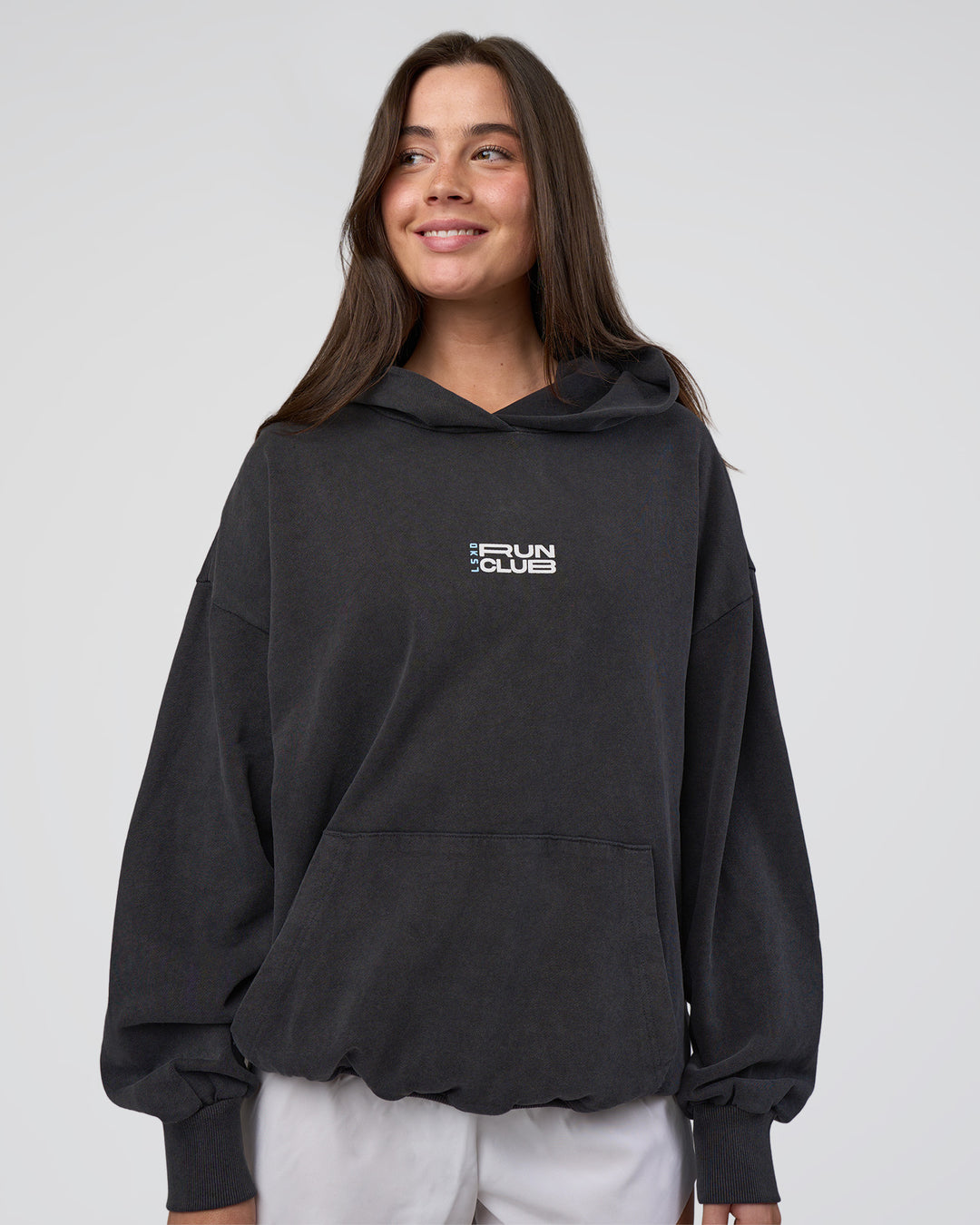 Woman wearing Runner’s Unisex Oversized Hoodie - Black Washed-White | Model:Estella | Size:XS