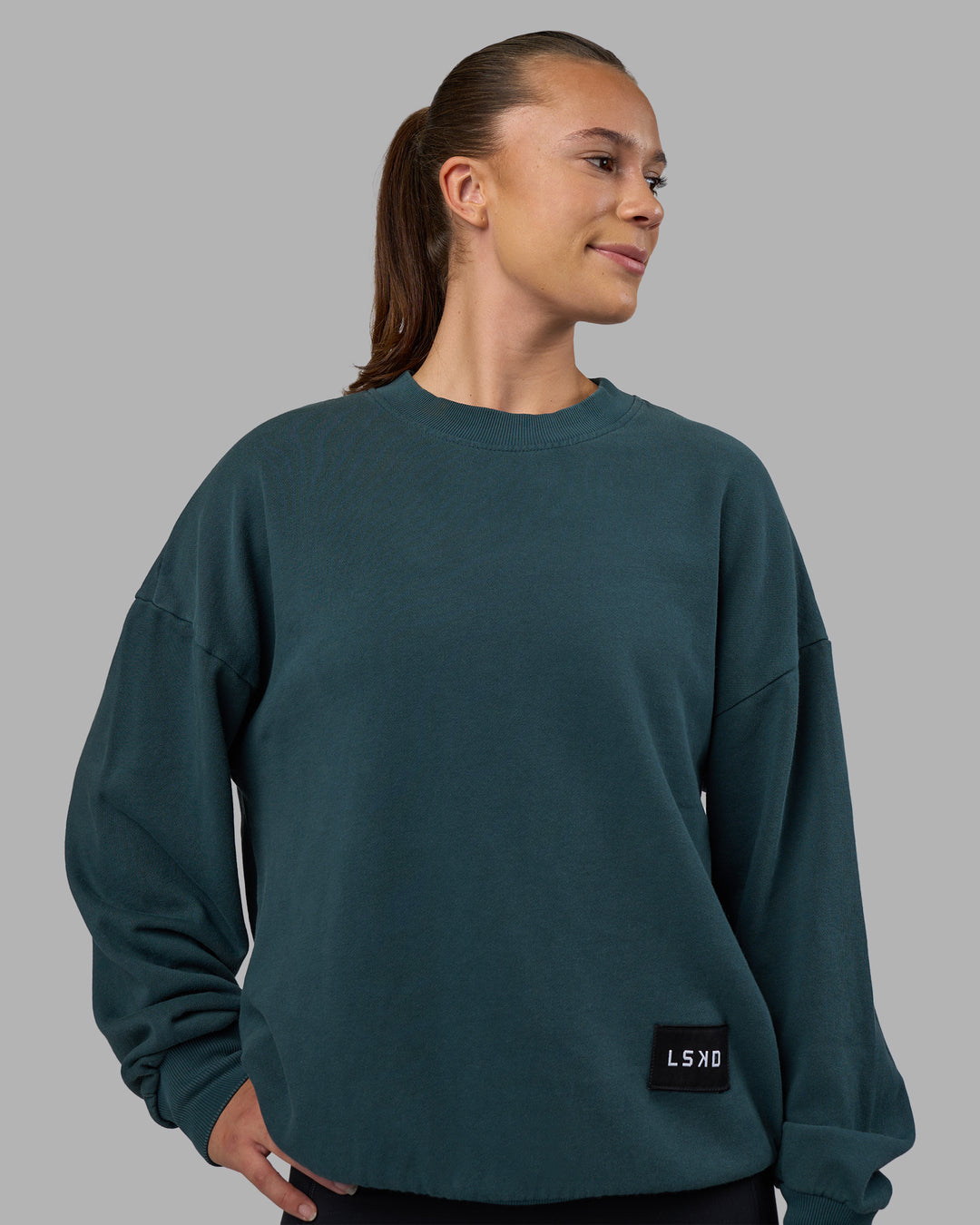 Woman wearing Segmented Oversized Sweater - Abyssal | Model:Charlize | Size:XS