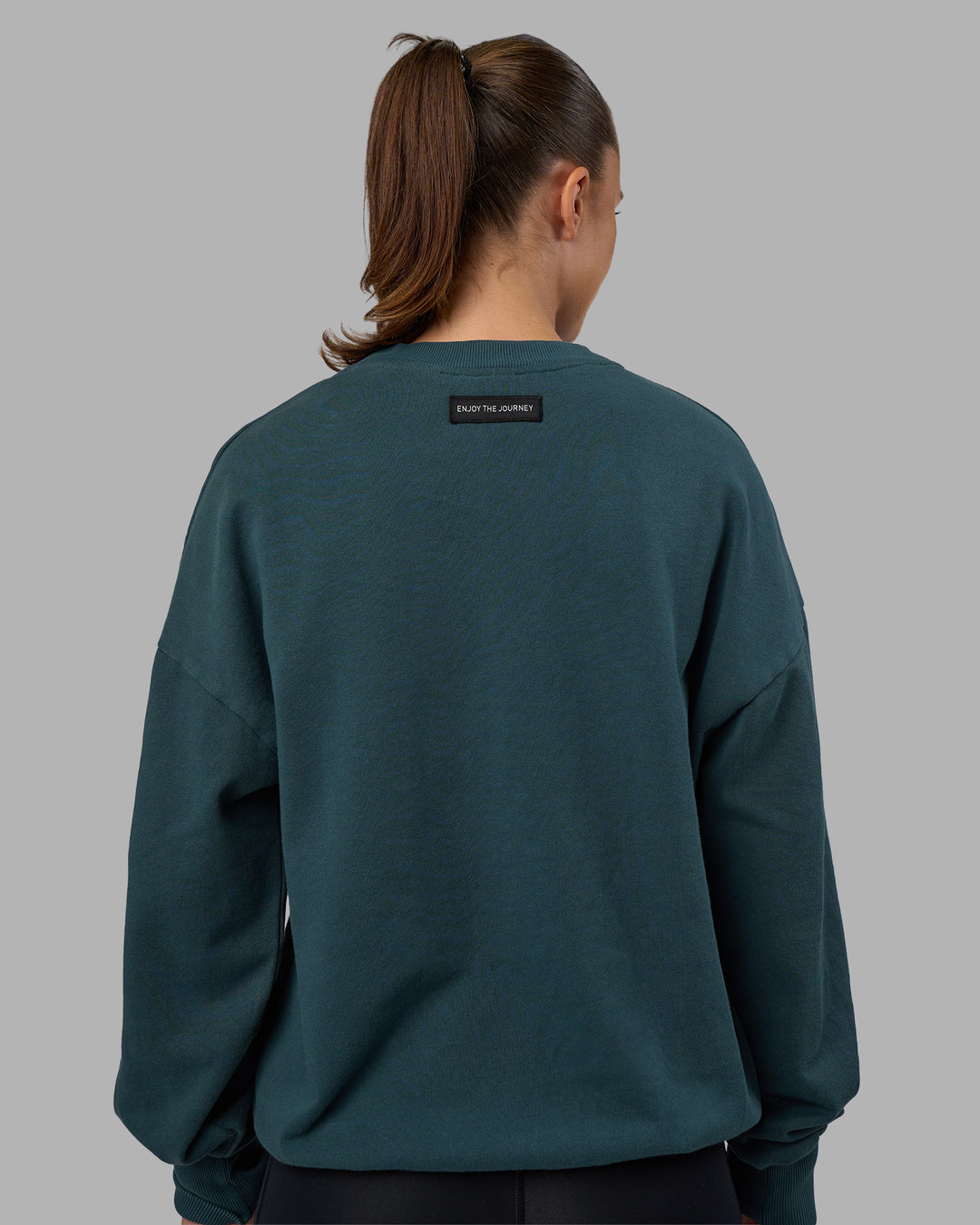 Woman wearing Segmented Oversized Sweater - Abyssal | Model:Charlize | Size:XS