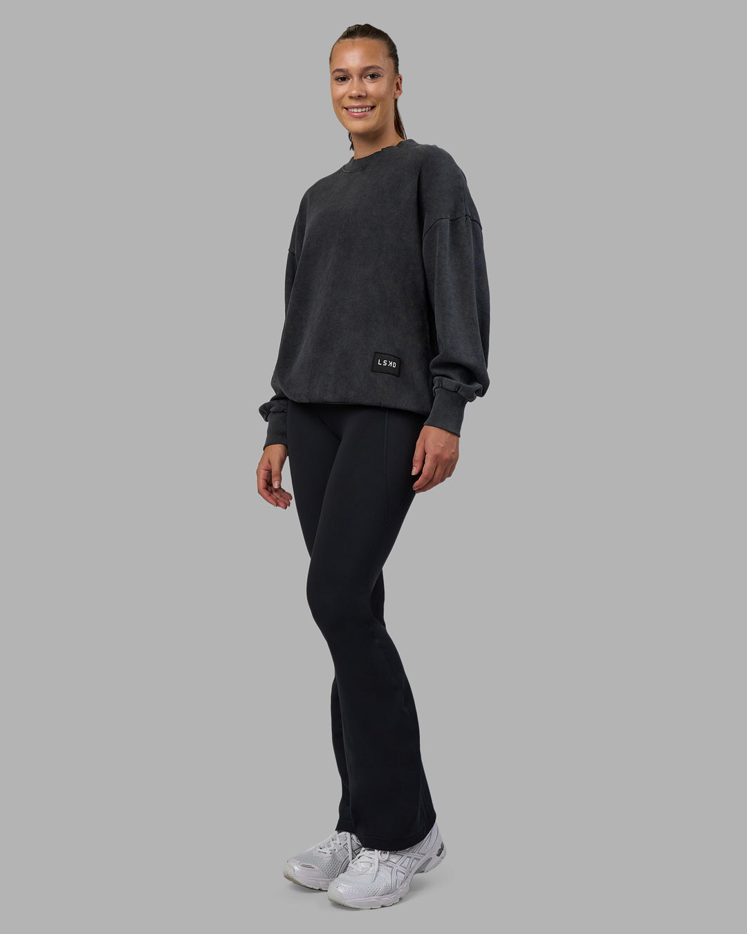 Woman wearing Segmented Oversized Sweater - Black Washed | Model:Charlize | Size:XS
