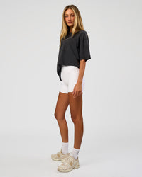 Woman wearing Shadow Mode FLXCotton Oversized Tee - Black Washed | Model:Georgia | Size:XS