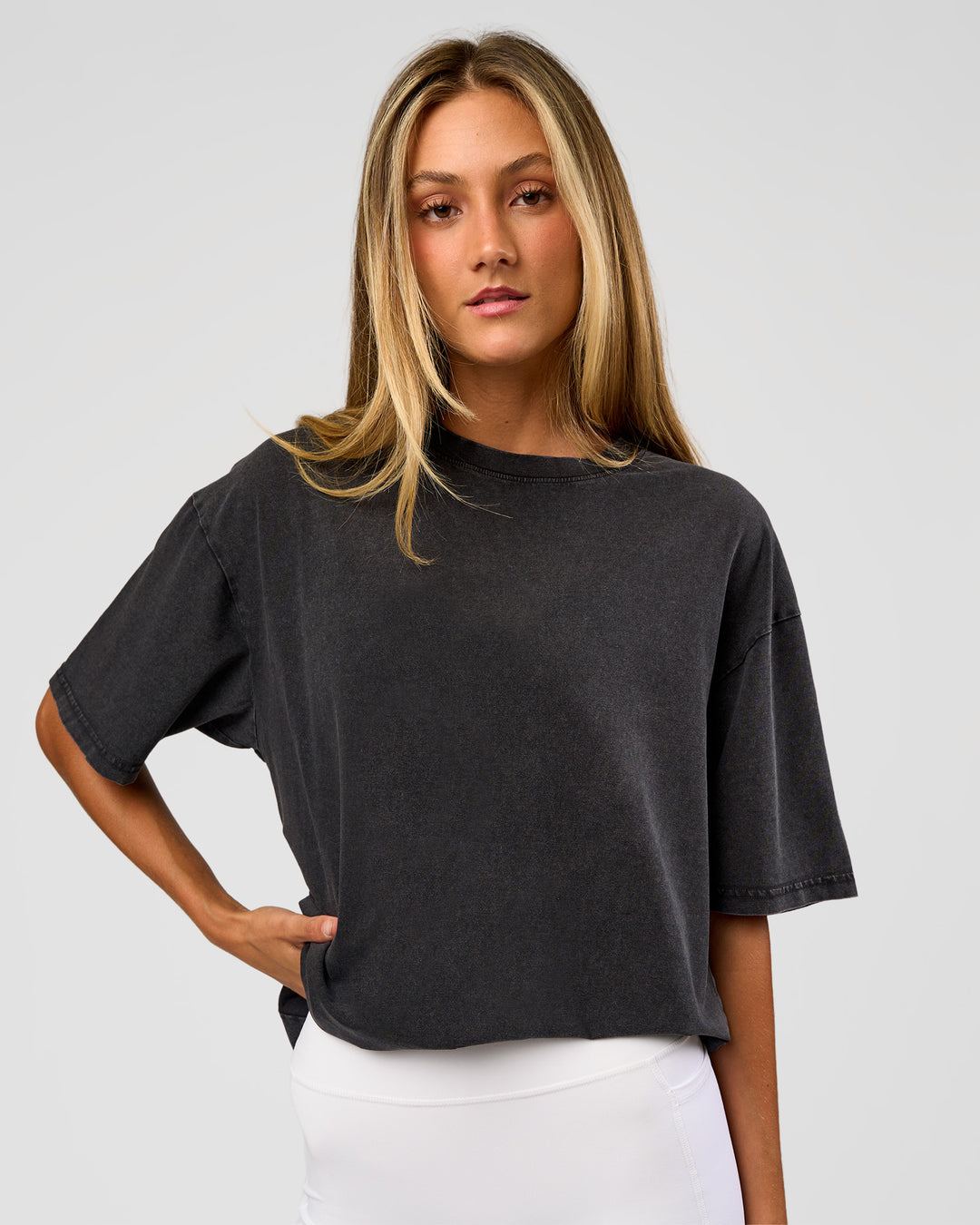 Woman wearing Shadow Mode FLXCotton Oversized Tee - Black Washed | Model:Georgia | Size:XS
