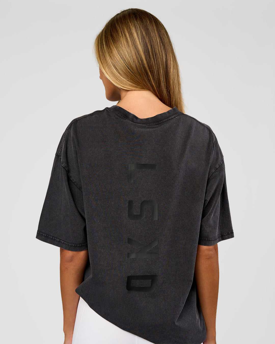 Woman wearing Shadow Mode FLXCotton Oversized Tee - Black Washed | Model:Georgia | Size:XS
