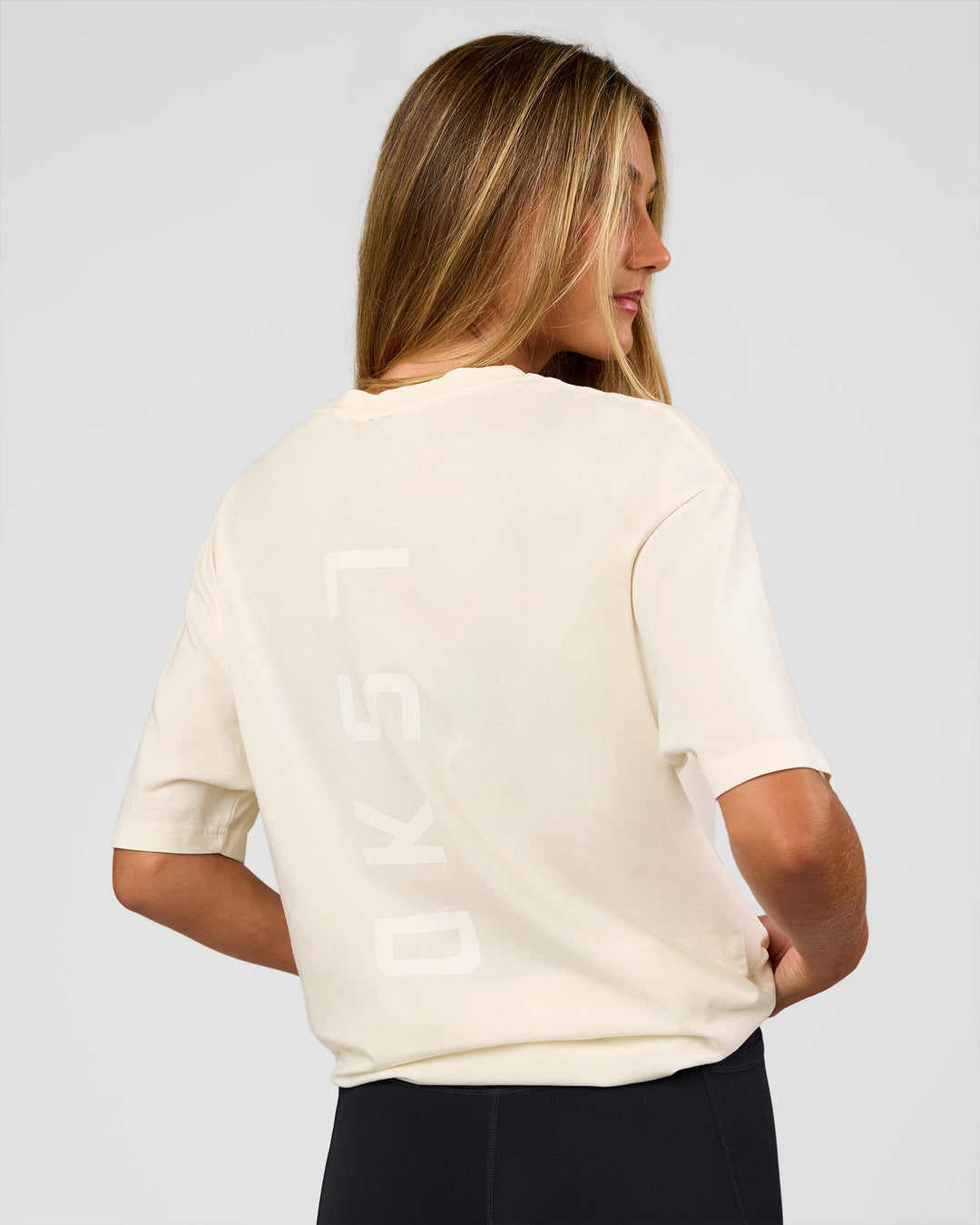 Woman wearing Shadow Mode FLXCotton Oversized Tee - Off White Washed | Model:Georgia | Size:XS