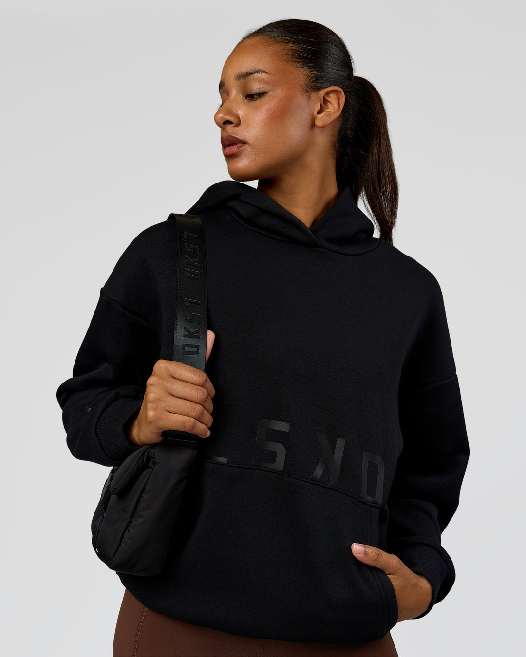 Woman wearing Shadow Mode Oversized Hoodie - Black | Model:Rosie | Size:XS