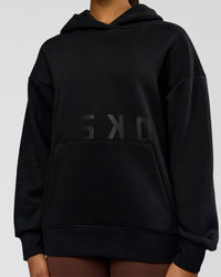 Woman wearing Shadow Mode Oversized Hoodie - Black | Model:Rosie | Size:XS