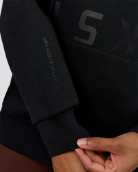 Woman wearing Shadow Mode Oversized Hoodie - Black | Model:Rosie | Size:XS