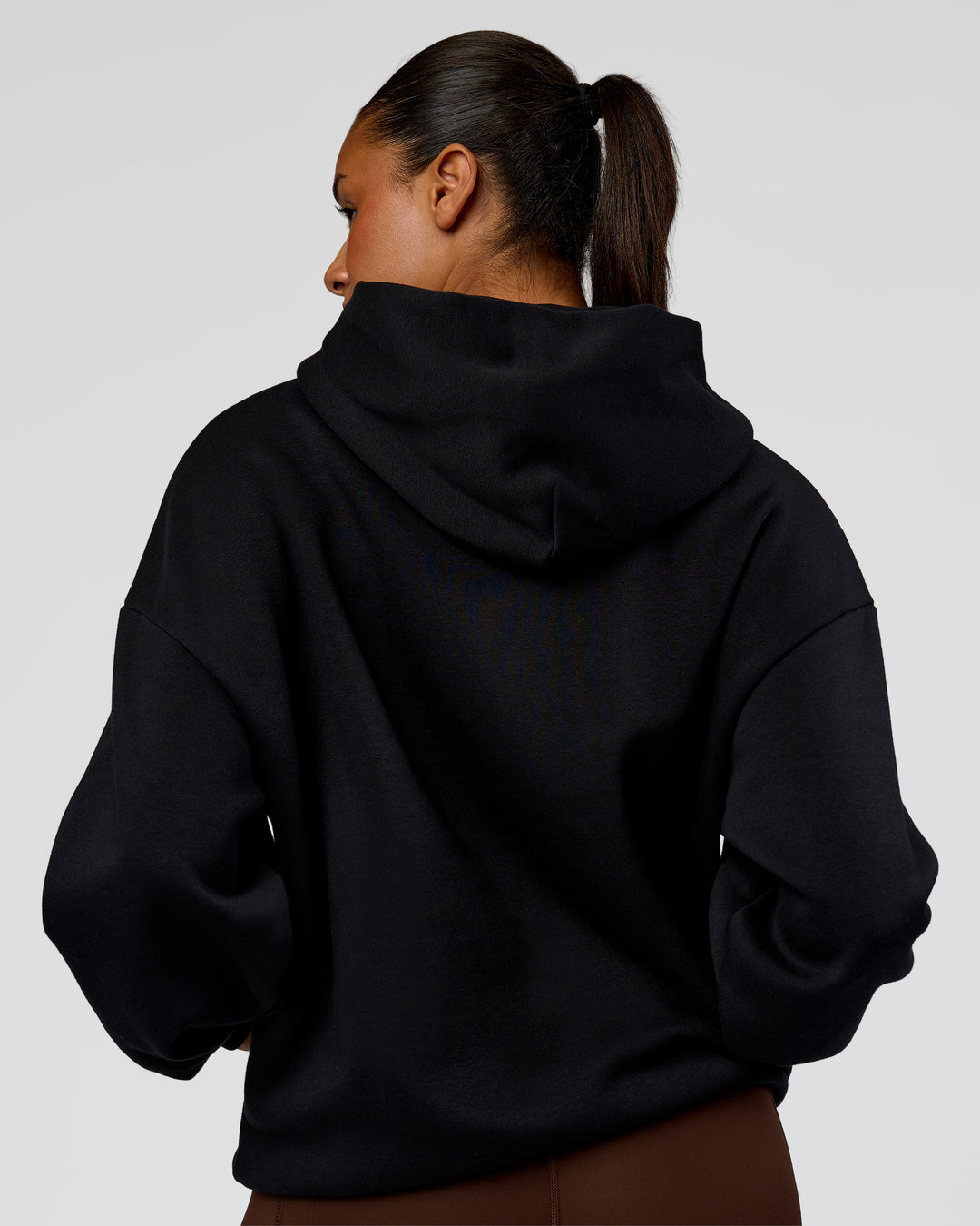 Woman wearing Shadow Mode Oversized Hoodie - Black | Model:Rosie | Size:XS