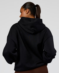 Woman wearing Shadow Mode Oversized Hoodie - Black | Model:Rosie | Size:XS