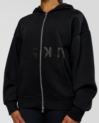 Woman wearing Shadow Mode Oversized Zip Through Hoodie - Black | Model:Rosie | Size:XS