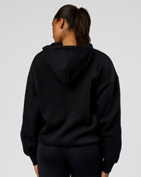 Woman wearing Shadow Mode Oversized Zip Through Hoodie - Black | Model:Rosie | Size:XS