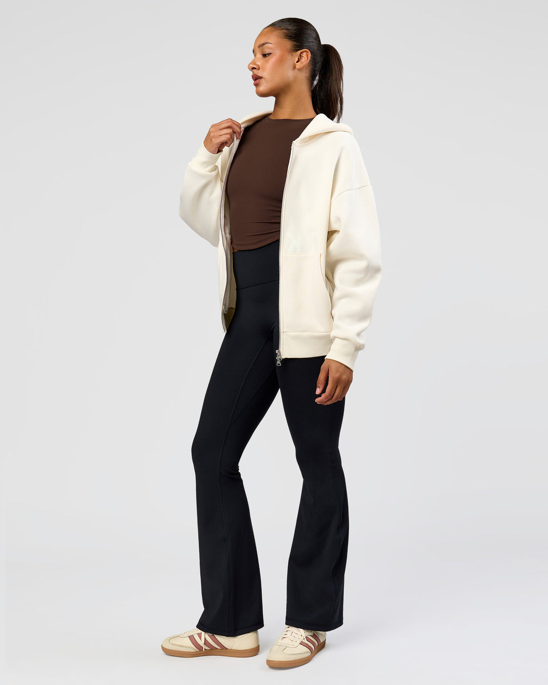 Woman wearing Shadow Mode Oversized Zip Through Hoodie - Off White | Model:Rosie | Size:XS