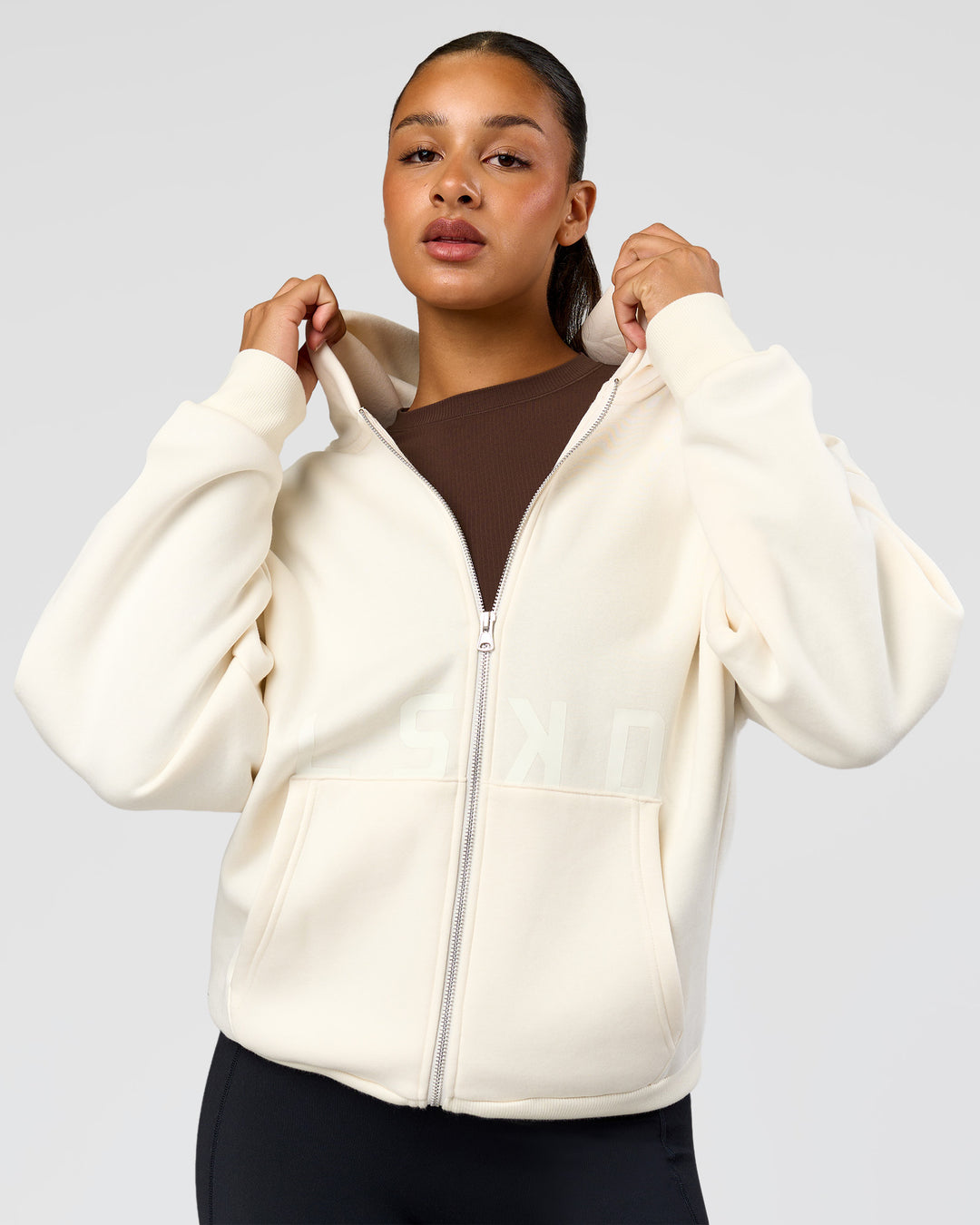 Woman wearing Shadow Mode Oversized Zip Through Hoodie - Off White | Model:Rosie | Size:XS