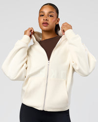 Woman wearing Shadow Mode Oversized Zip Through Hoodie - Off White | Model:Rosie | Size:XS