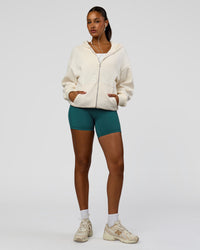 Woman wearing Shadow Mode Oversized Zip Through Hoodie - Off White | Model:Rosie | Size:XS