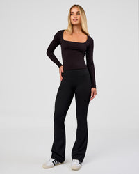 Woman wearing Show It Off Long Sleeve Top in Black | Model:Issy | Size:XS