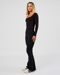Woman wearing Show It Off Long Sleeve Top in Black | Model:Issy | Size:XS