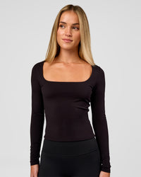 Woman wearing Show It Off Long Sleeve Top in Black | Model:Issy | Size:XS