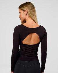 Woman wearing Show It Off Long Sleeve Top in Black | Model:Issy | Size:XS