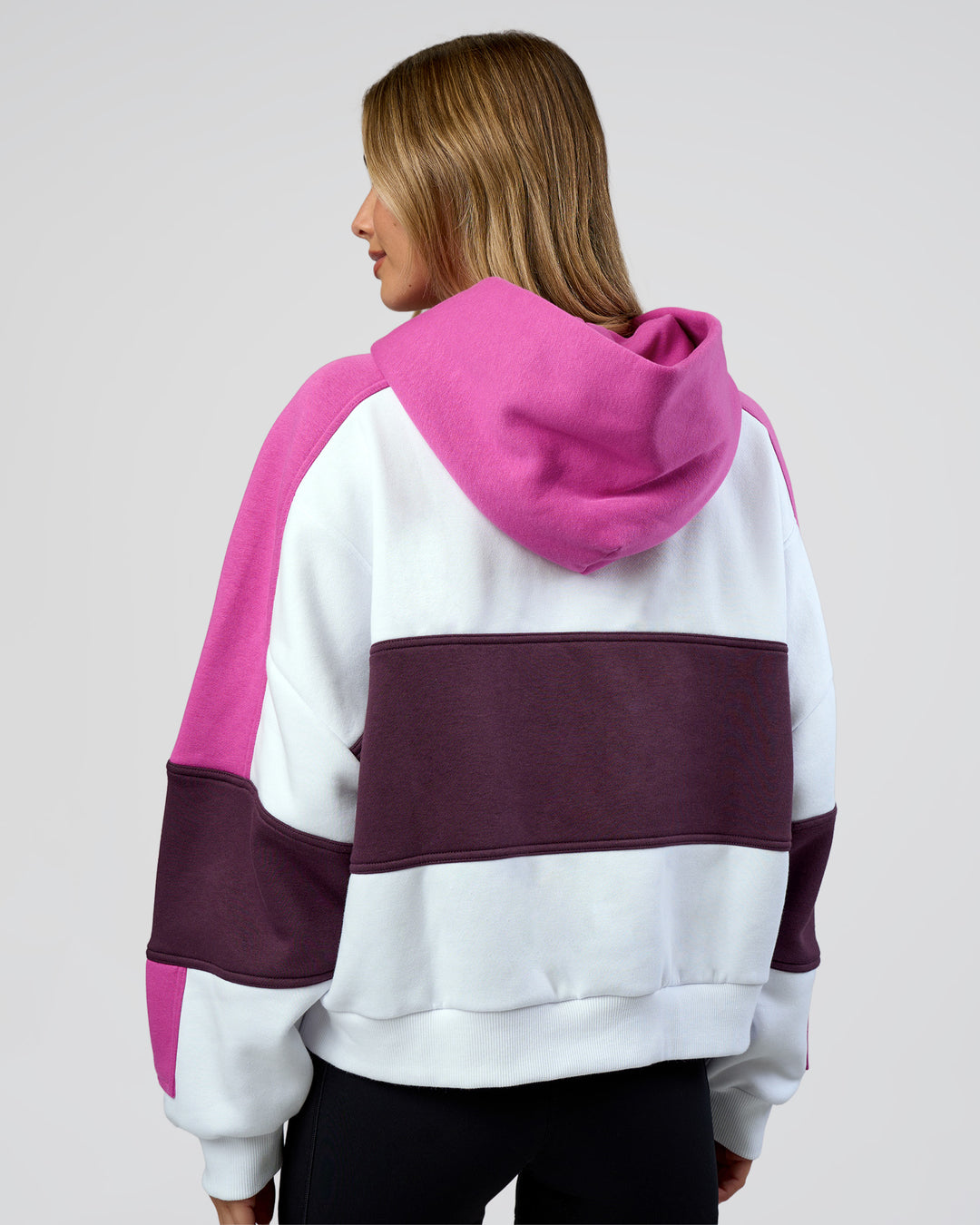 Woman wearing Slam Cropped Oversized Hoodie - White-Ultra Fuchsia | Model:Leilani | Size:XS