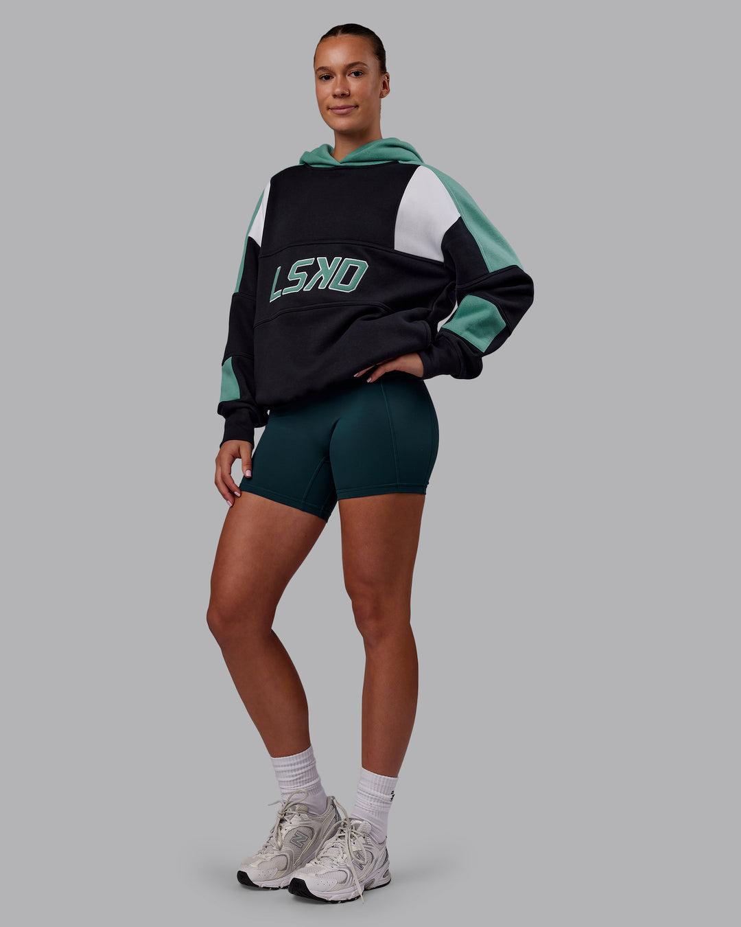 Woman wearing Slam Oversized Hoodie - Caviar-Agate Green | Model:Charlize | Size:XS