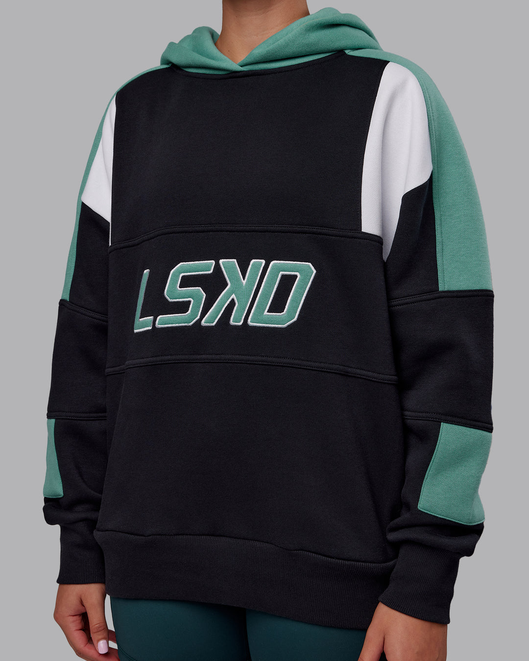 Woman wearing Slam Oversized Hoodie - Caviar-Agate Green | Model:Charlize | Size:XS