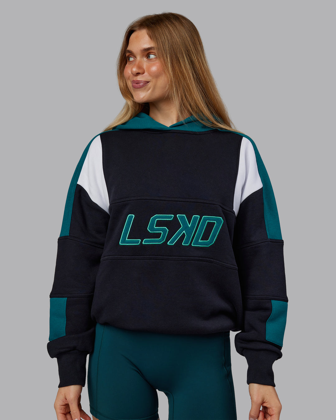 Woman wearing Slam Oversized Hoodie - Caviar-Blue Coral | Model:Emilie | Size:XS