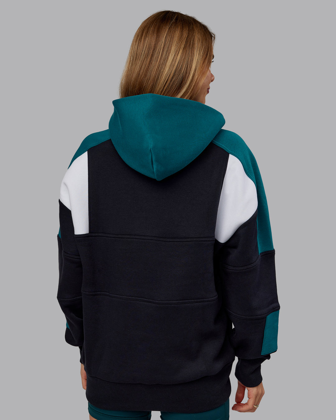 Woman wearing Slam Oversized Hoodie - Caviar-Blue Coral | Model:Emilie | Size:XS