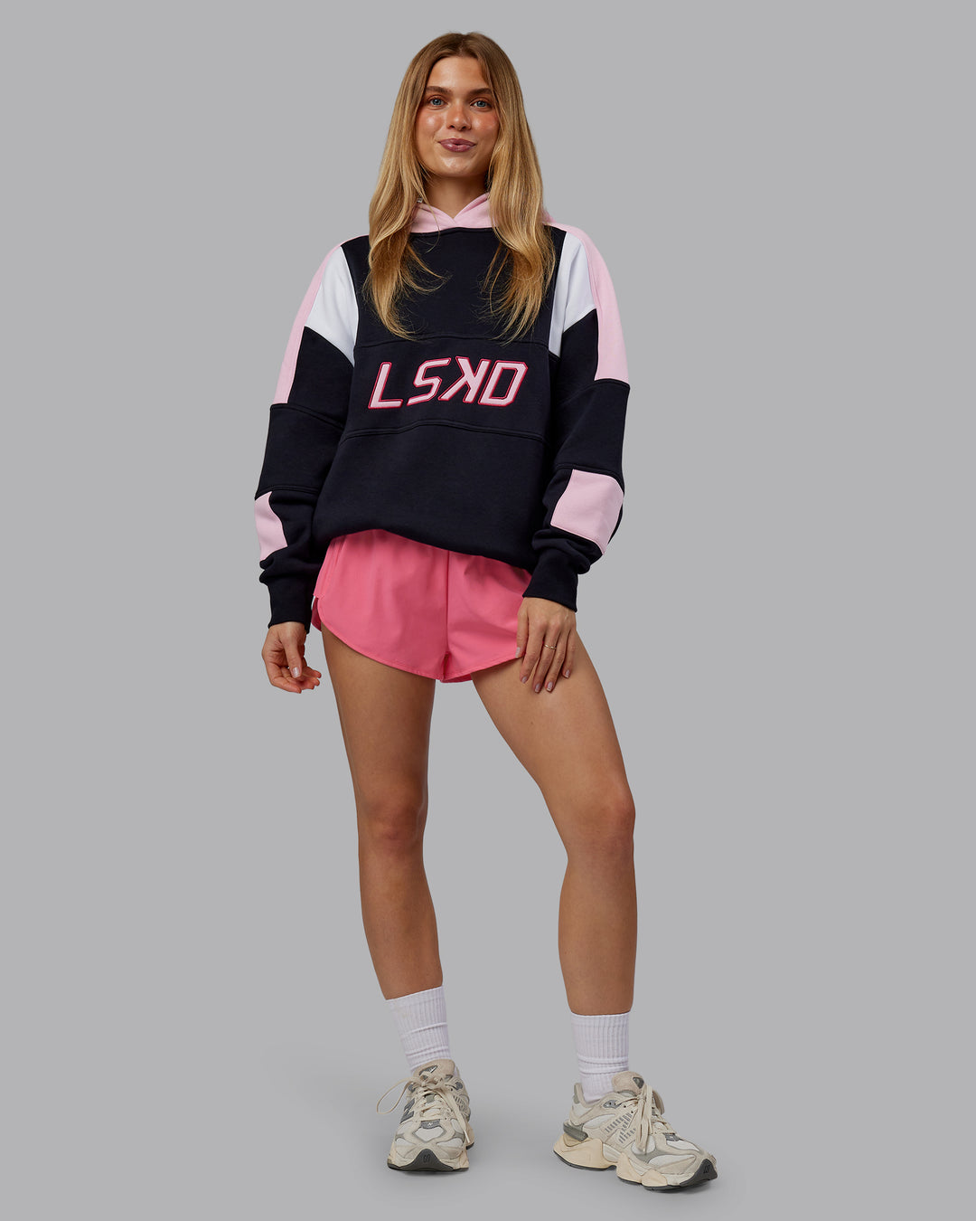 Woman wearing Slam Oversized Hoodie - Caviar-Light Bubblegum | Model:Emilie | Size:XS