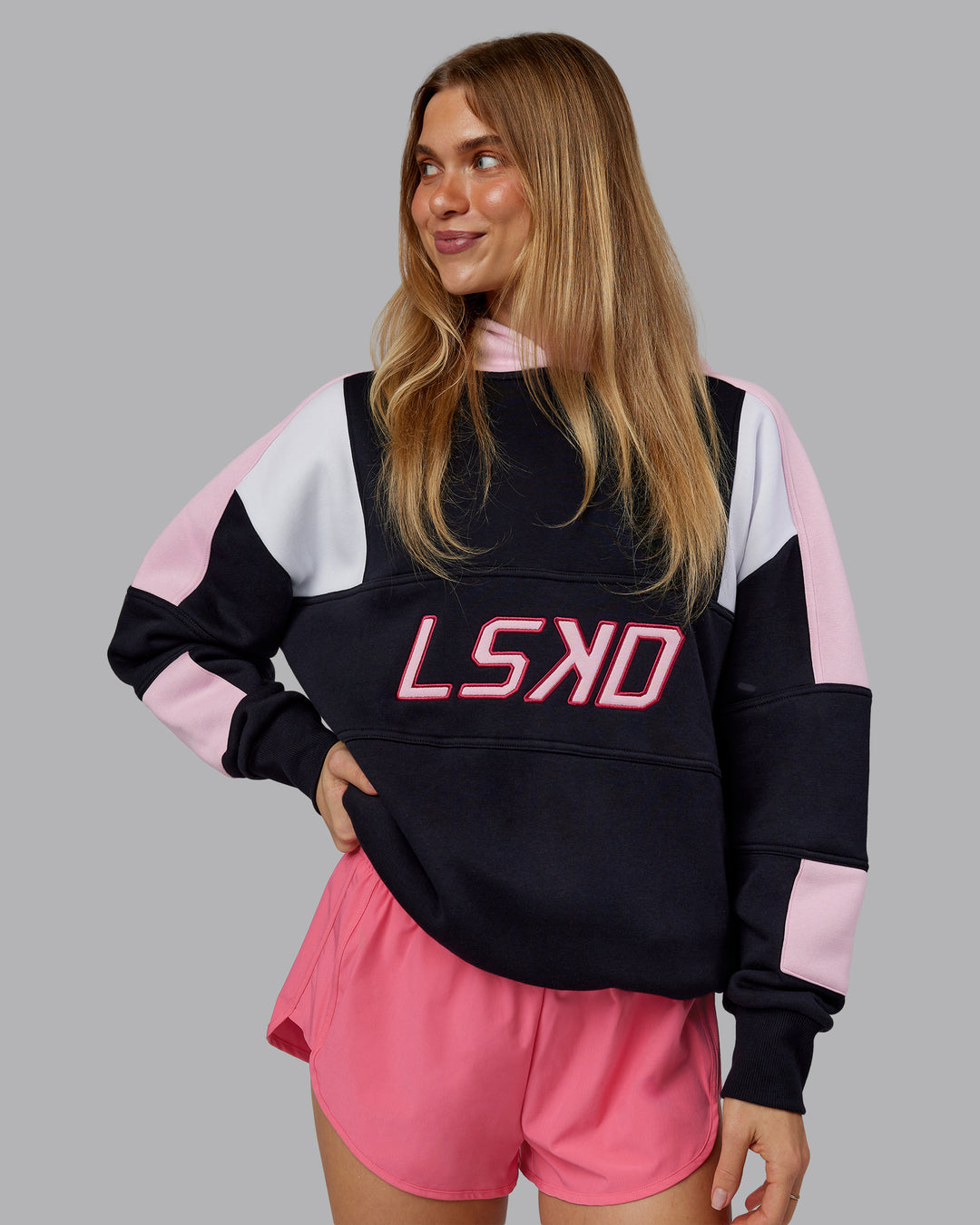 Woman wearing Slam Oversized Hoodie - Caviar-Light Bubblegum | Model:Emilie | Size:XS