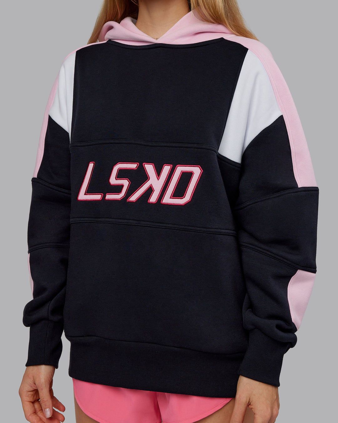 Woman wearing Slam Oversized Hoodie - Caviar-Light Bubblegum | Model:Emilie | Size:XS