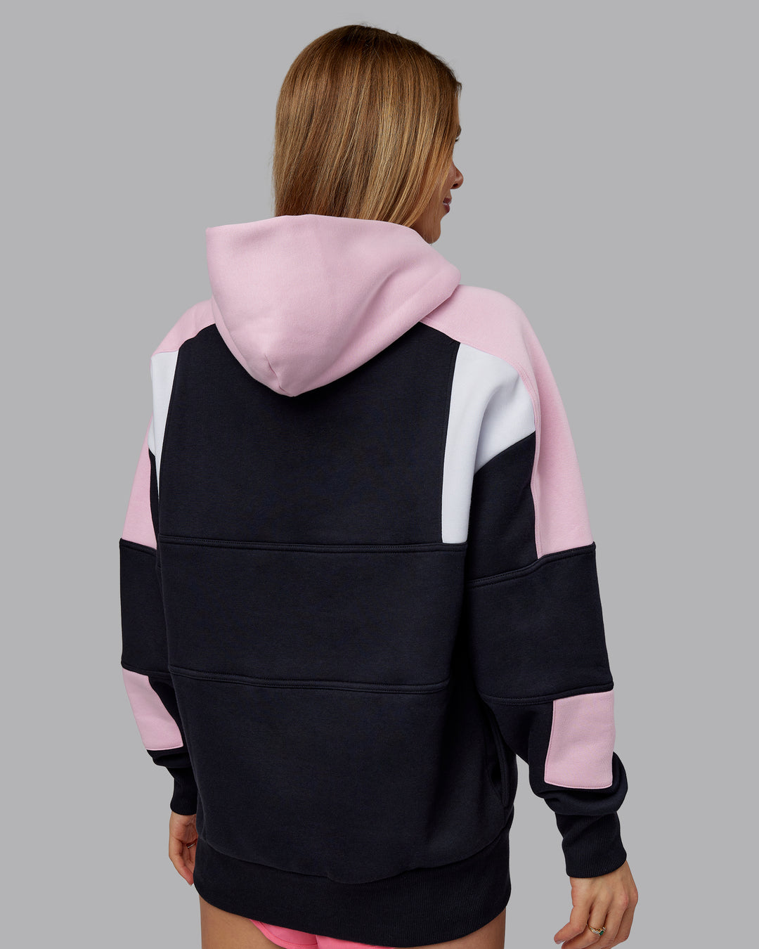 Woman wearing Slam Oversized Hoodie - Caviar-Light Bubblegum | Model:Emilie | Size:XS