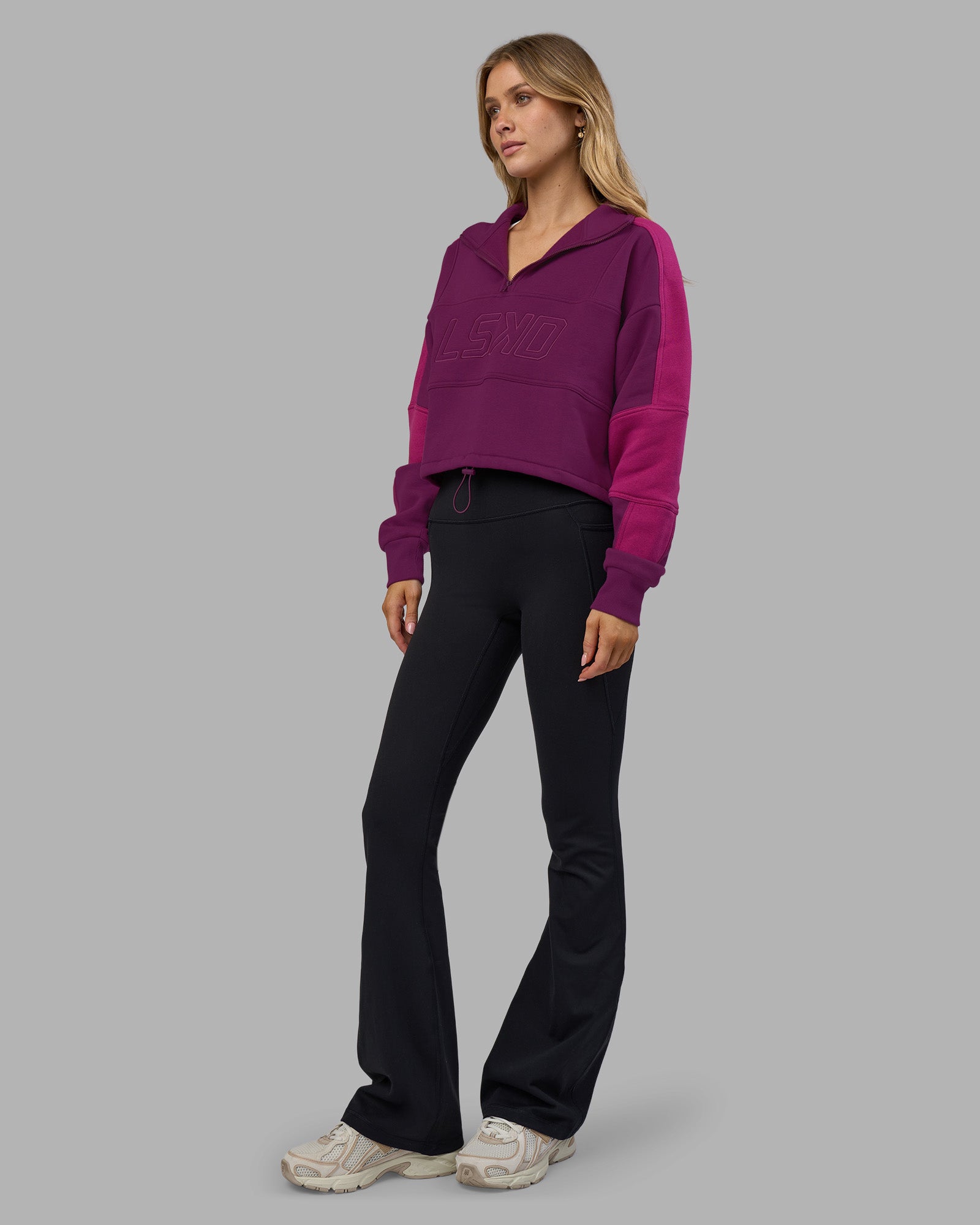 Woman wearing Slam Quarter Zip Sweater - Plum Caspia-Boysenberry | Model:Leilani | Size:XS