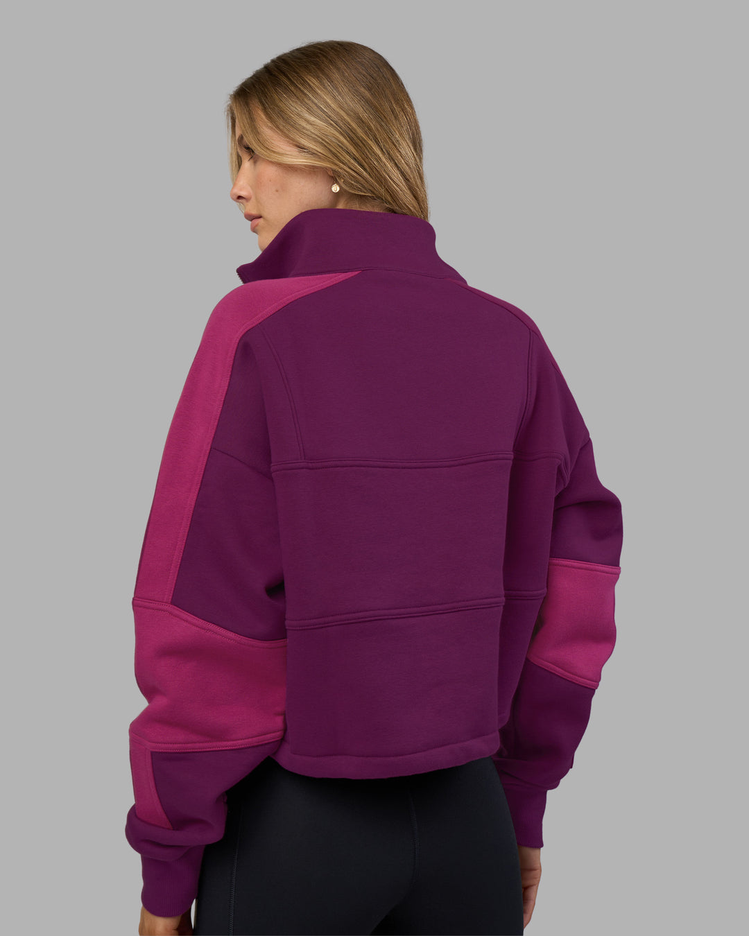 Woman wearing Slam Quarter Zip Sweater - Plum Caspia-Boysenberry | Model:Leilani | Size:XS