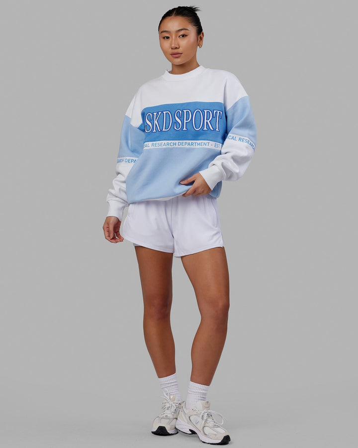 Woman wearing Unisex Sportif Sweater Oversize - Windsurfer-Azure Blue